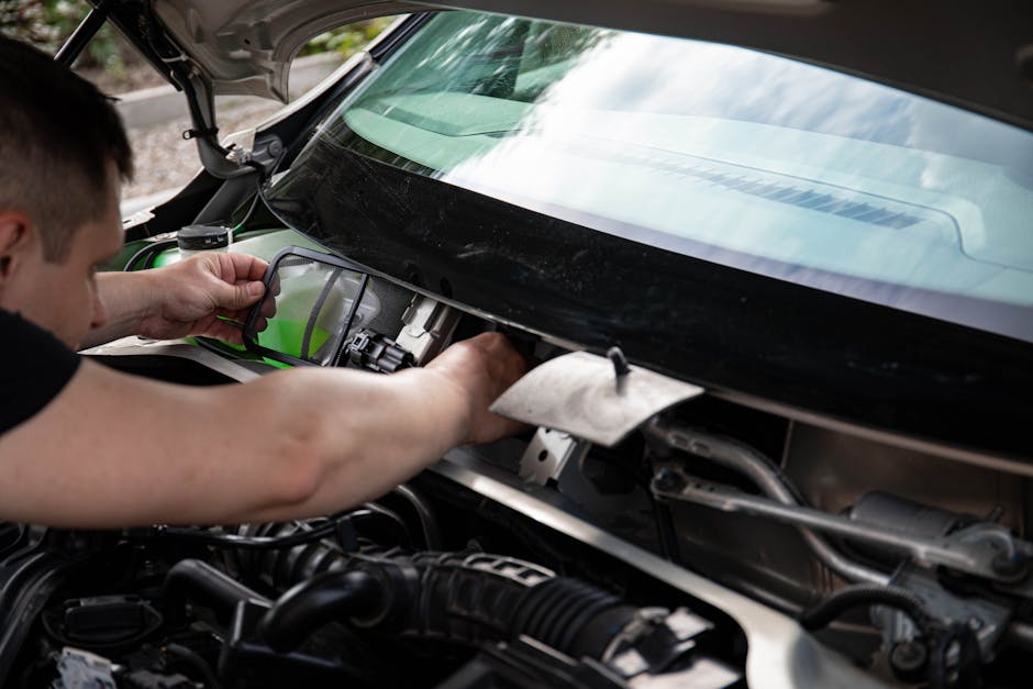 Close up of auto glass chip repair process